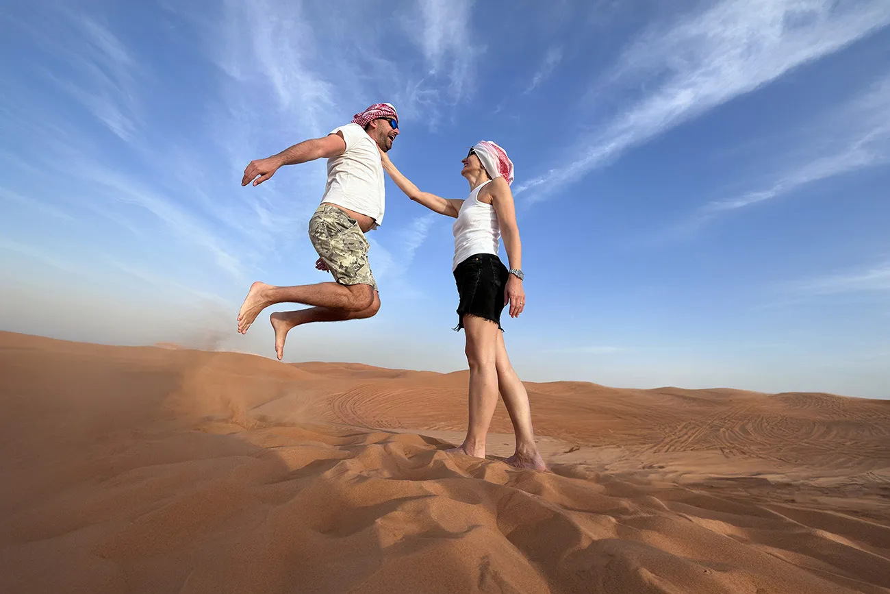Sandboarding on red dunes