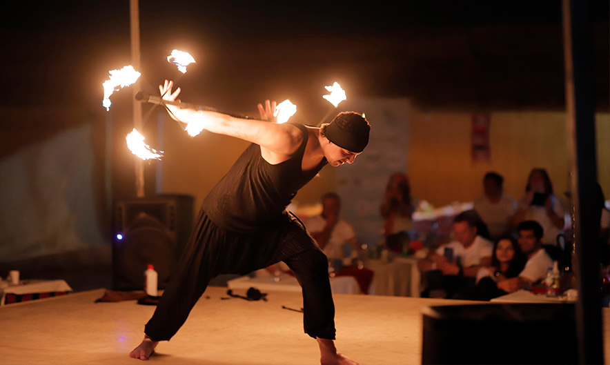 Guests enjoying camel ride during evening safari