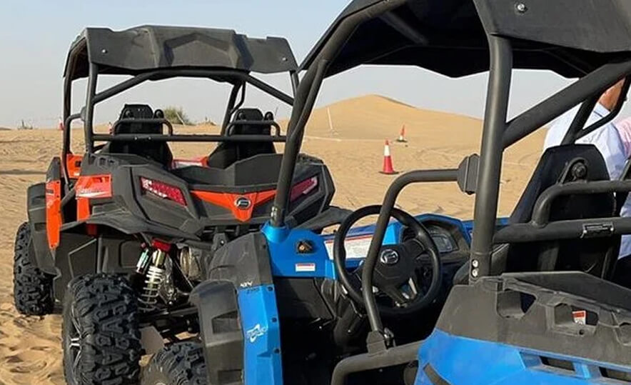 Polaris RZR 1000 CC 4-seater buggy parked in Dubai desert